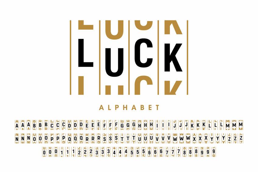 The letters of the word LUCK presented as though they were in the window of a slot machine